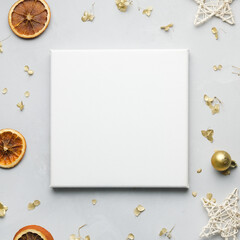 Blank frame canvas and Christmas decoration on gray background. Copy space for message or photo. Christmas, New Year concept. 