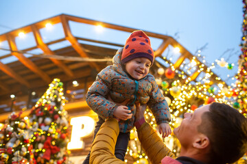 Family walking the christmas streets