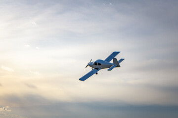 Fototapeta na wymiar Small modern private jet in the sky.