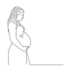 Pregnant woman with long hair holds her hands on her stomach with baby.