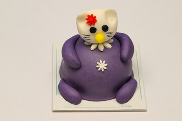 Sugar paste animals. Colorful cake, on a white background, with decorative cake. Cute animal cakes.