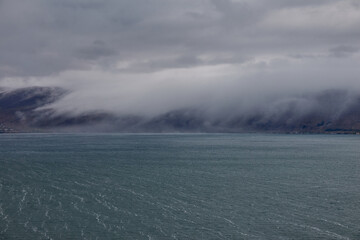 Sevan Lake on Rainy Day with Clouds over Hills in Armenia