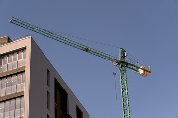Aerial view big construction crane, close up. Construction crane on a building background, close up.