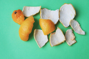 Peel from tangerine on a green background