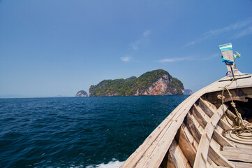 Travel by Thailand. Bow of traditional thai wooden longtail boat sailing the sea.