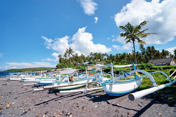 Fototapeta na wymiar Beautiful landscape. Ocean beach and indonesian fishing boats.