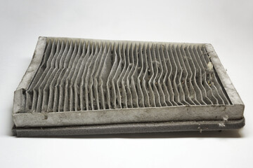cabin air filter, wear out, dirty, with clogged deformed grid of carbon filtering media and foam...