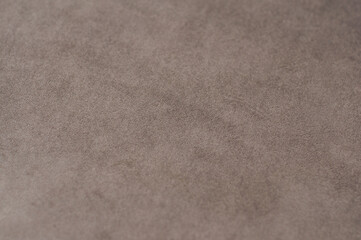 The texture of the fabric is velor beige. Background Velvet upholstery furniture