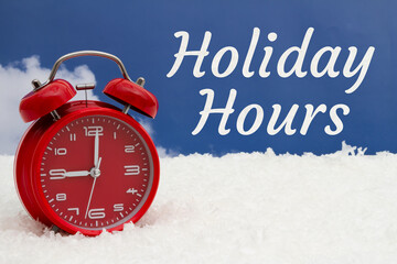 Holiday Hours message with red alarm clock and snow