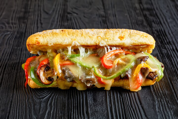 philly steak sandwich with melted cheese, top view