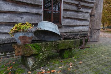 Naklejka premium farm with old zink tub on stone bench