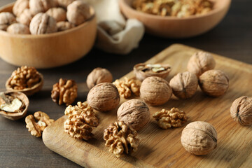 Concept of healthy food with walnuts on wooden background
