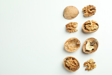 Flat lay composition with walnuts on white background