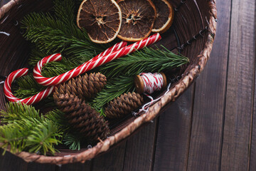 basket with Christmas sweets and decorations, top view