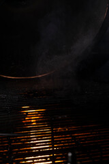 selective focus, fire texture, grill grill with burning coals. background for menus and ads