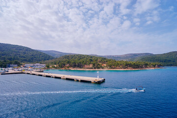 Fototapeta na wymiar Concrete sea pier on the mediterranean island.