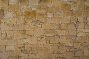 View on light brown stone wall. Texture