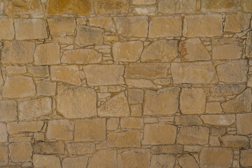 View on light brown stone wall. Texture