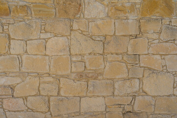 View on light brown stone wall. Texture