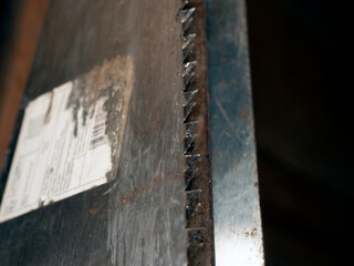 Blade and teeth on a hacksaw for wood. Carpentry tool, cutter fragment