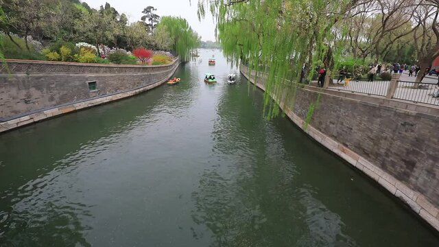 Cruise ships travel in Beihai Park, Beijing