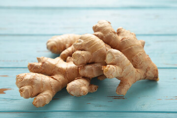Fresh ginger on a blue background. Healthy food