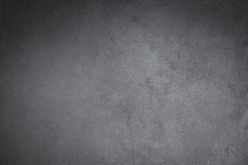 Abstract texture of dark gray vintage cement or concrete wall background. School education, dark wall backdrop, template for learning board concept.