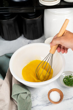 Eggs in bowl being whisked