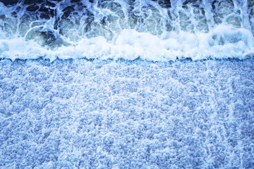 Fototapeta premium Blue water flows from a dam 