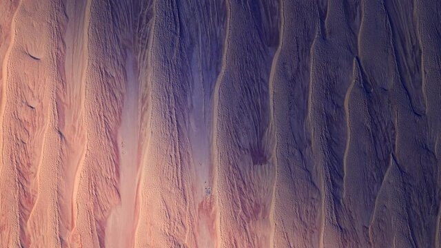 Sunrise on desert sand dunes waves animation, desertification and global warming background concept. Based on images furnished by Nasa