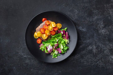 grilled steak with vegetables, fresh salad