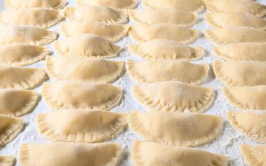 Hand-made dumplings with flour powder.
