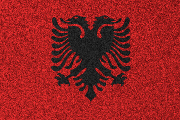 Patriotic glitter background in color of Albania flag