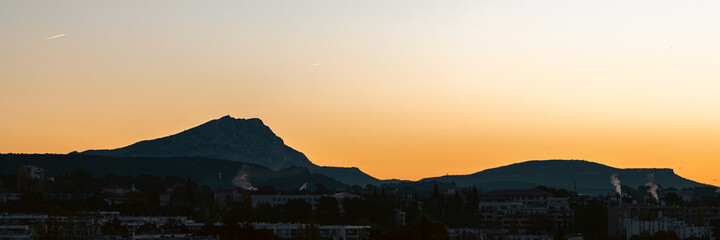 Sainte Victoire mountain in the light of the rising sun in autumn