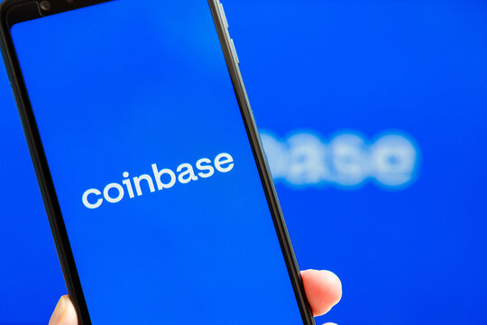 Ukraine, Odessa - October, 9 2021: Coinbase mobile app running at smartphone screen with Coinbase logo at background. Coinbase - American cryptocurrency exchange and trading platform.