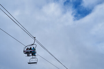 Image of a chair lift at a ski resort.