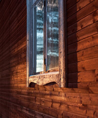 Old window on red building in Sweden