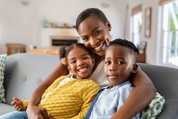 Happy african american mother with little son and smiling daughter - Powered by Adobe