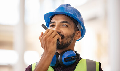 Mixed race construction worker using walkie on construction site