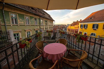 Empty tables and seats at a terrace from a restaurant during COVID-19 pandemic. Photo taken in Sibiu city from Transylvania, Romania.