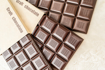 Handmade chocolate. Black bitter craft chocolate on white background. Healthy food concept,...