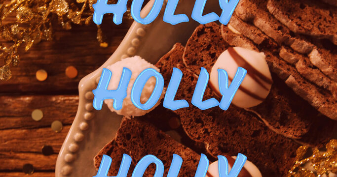 Image of holly text in repetition over christmas decorations