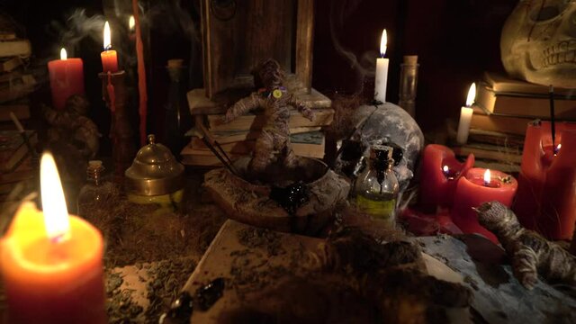 Voodoo ritual table. The general appearance of the ritual scene, prepared in a magical, impressive, dark and frightening atmosphere.