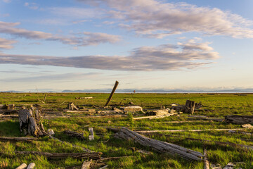 Sturgeon Banks Natural Area sunset sky with clouds with mountains in background