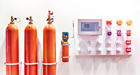 Gas cylinders and monitoring device in fire alarm systems