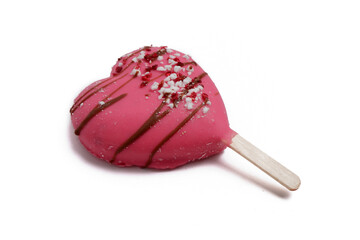 pink ice cream on a heart-shaped stick lies isolated on a white background