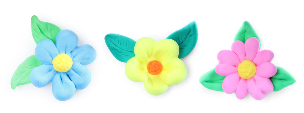 Different flowers with leaves made from playdough on white background, collage. Banner design