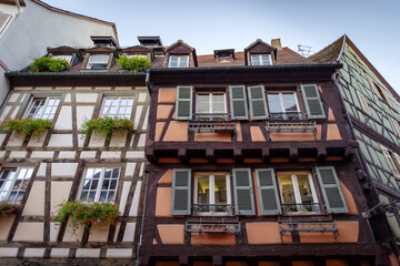 Fototapeta na wymiar Traditional facades of historic houses in Colmar old town, north-eastern France