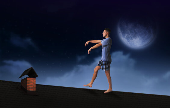 Sleepwalker wearing pajamas on roof in night