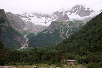 View of mountains in green valley in summertime